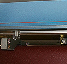 Thickness measurement in hot melt calenders